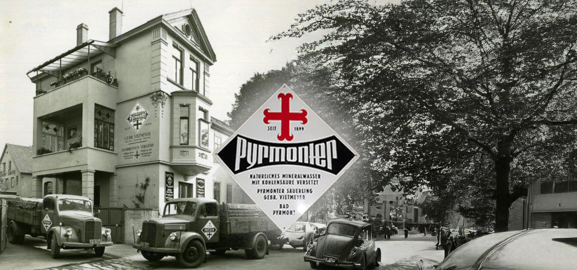Altes Foto des Pyrmonter Mineralwasserwerks mit LKWs und historischem Firmenlogo.
